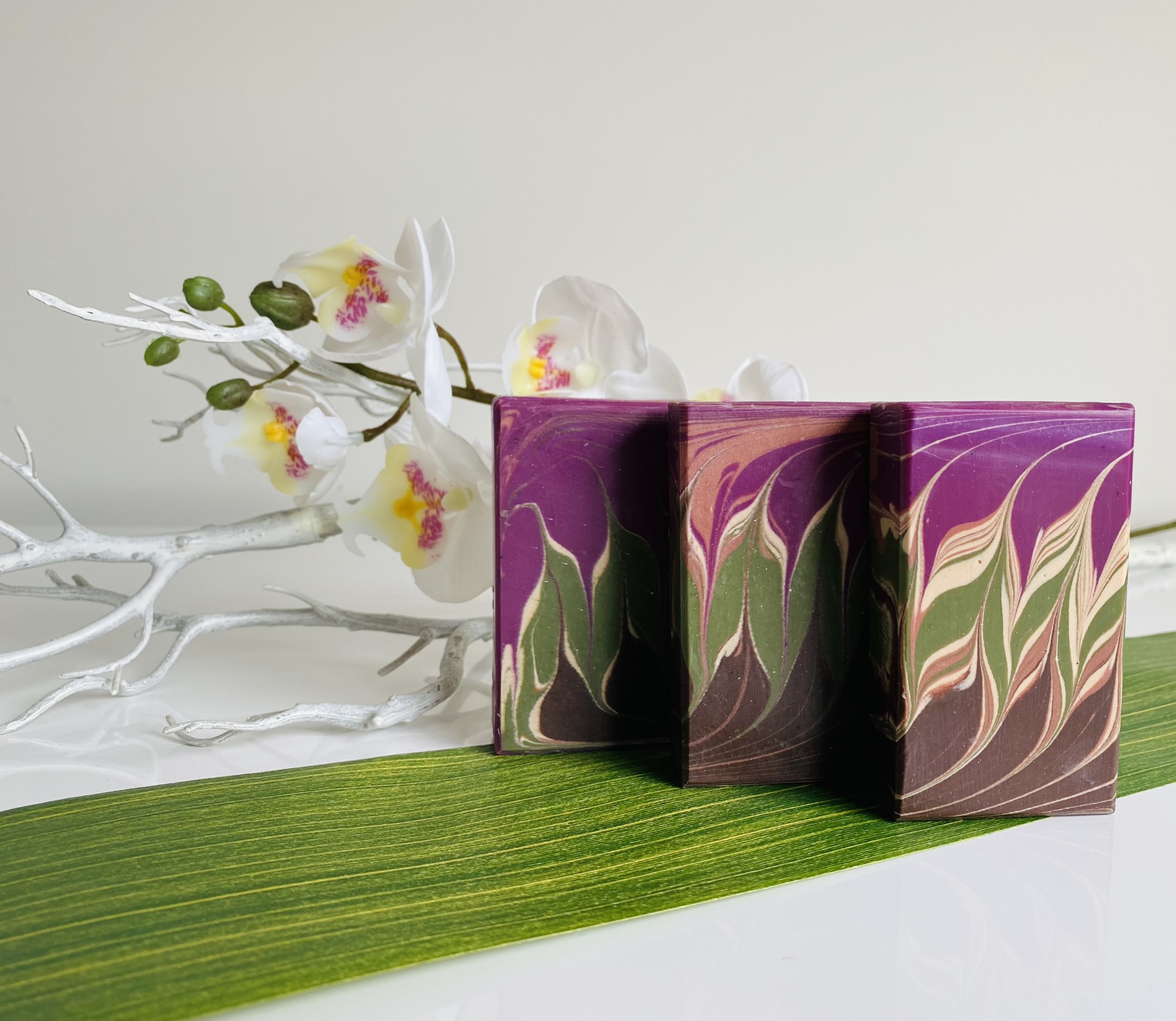 Original photograph of patterned handmade soap bars and white orchid flowers
